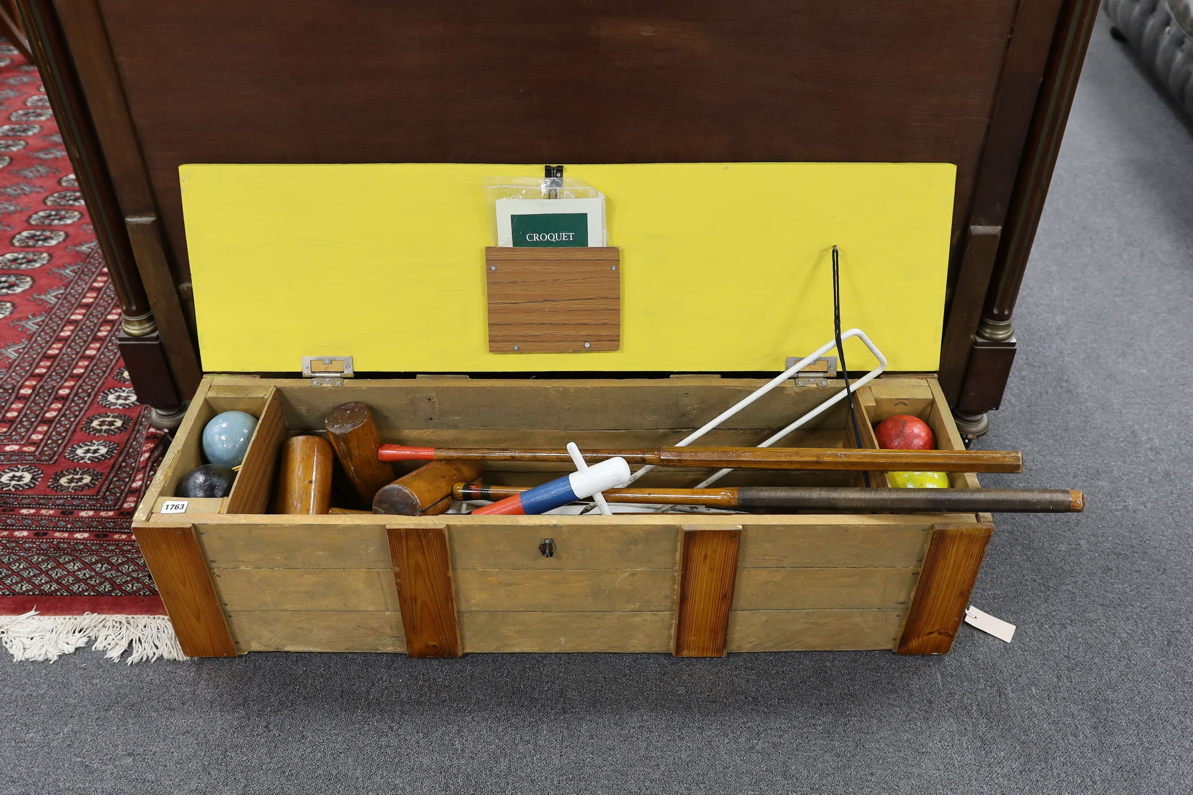 A vintage matched croquet set in later case